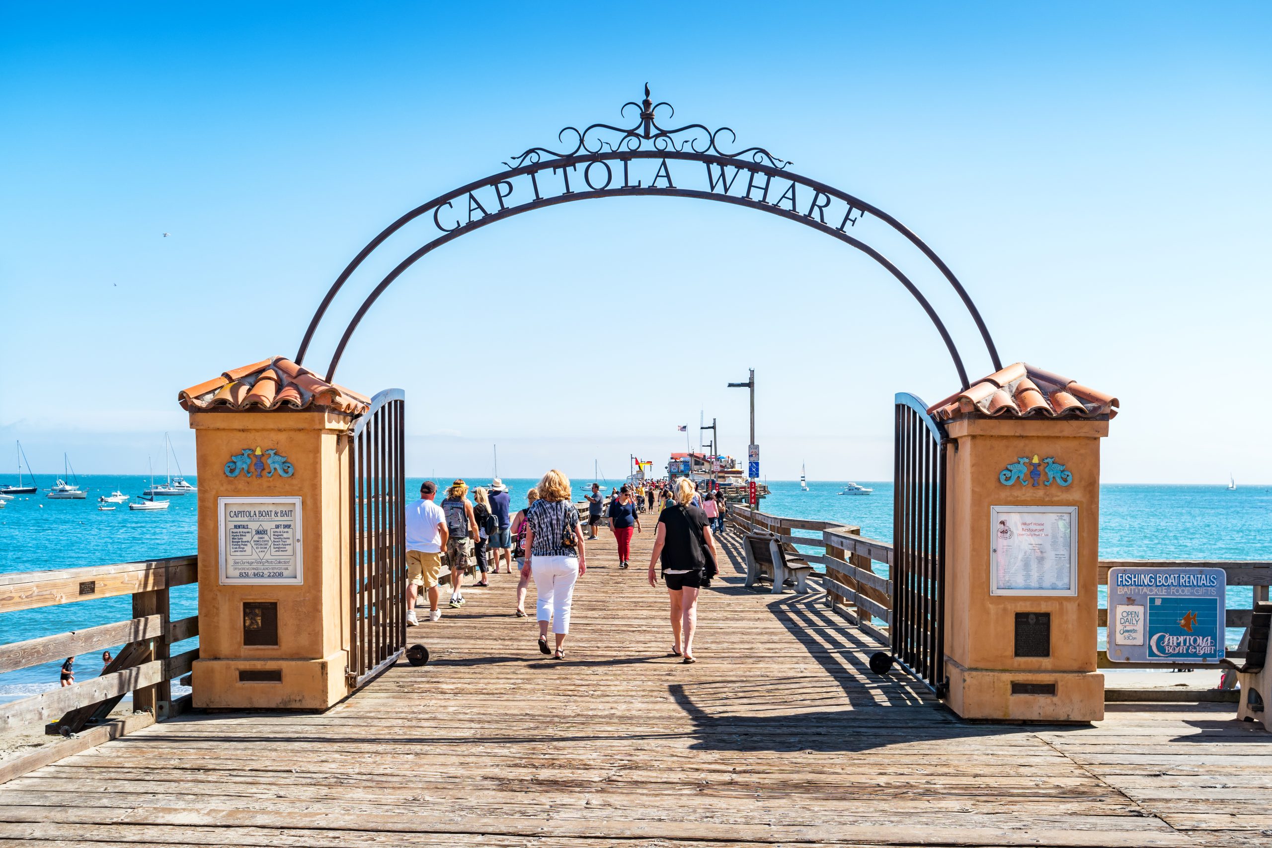 People enjoy the Capitola Wharf in Capitola, California, USA, on a sunny day.