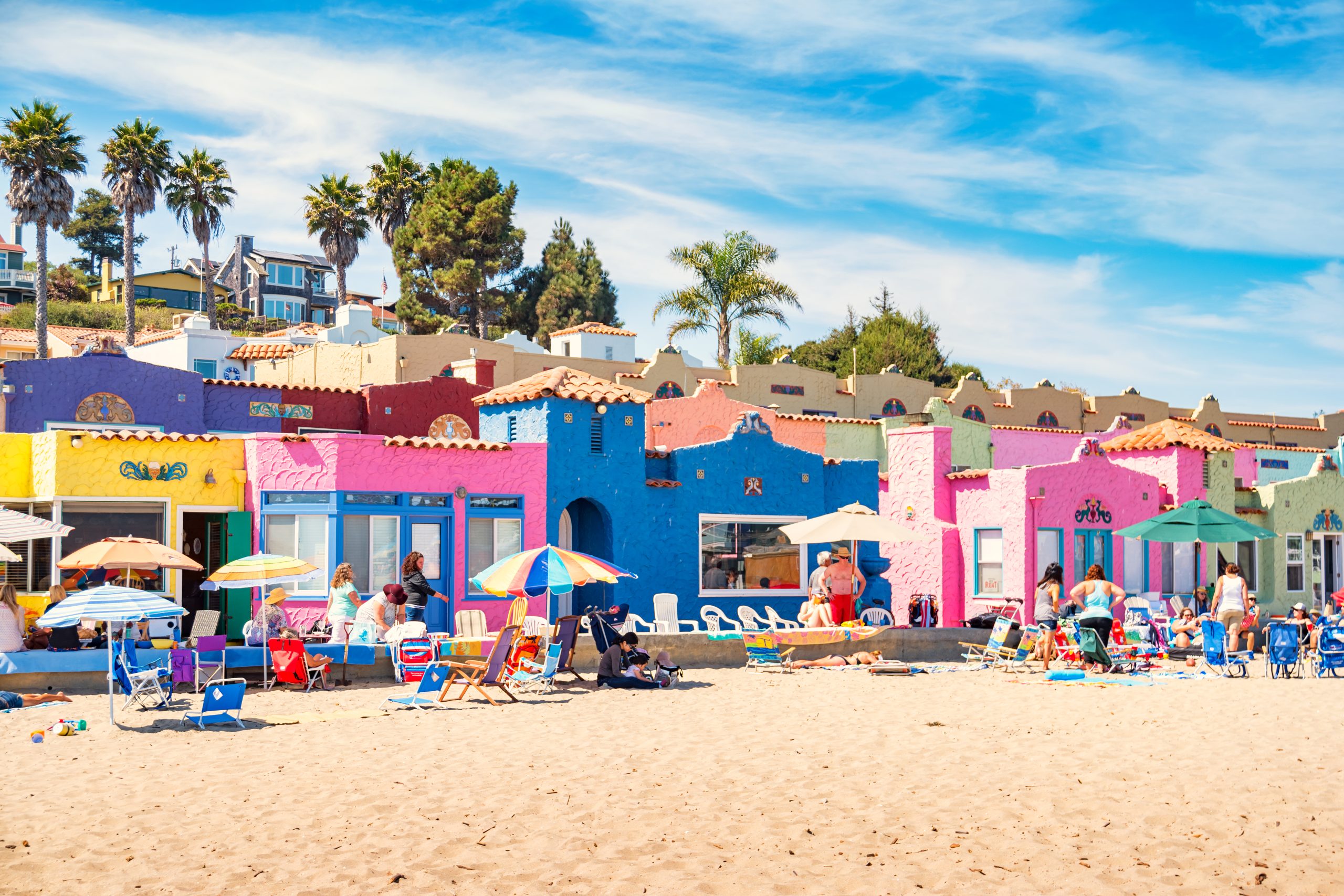 People enjoy a sunny day on the beach in charming Capitola, California, USA.