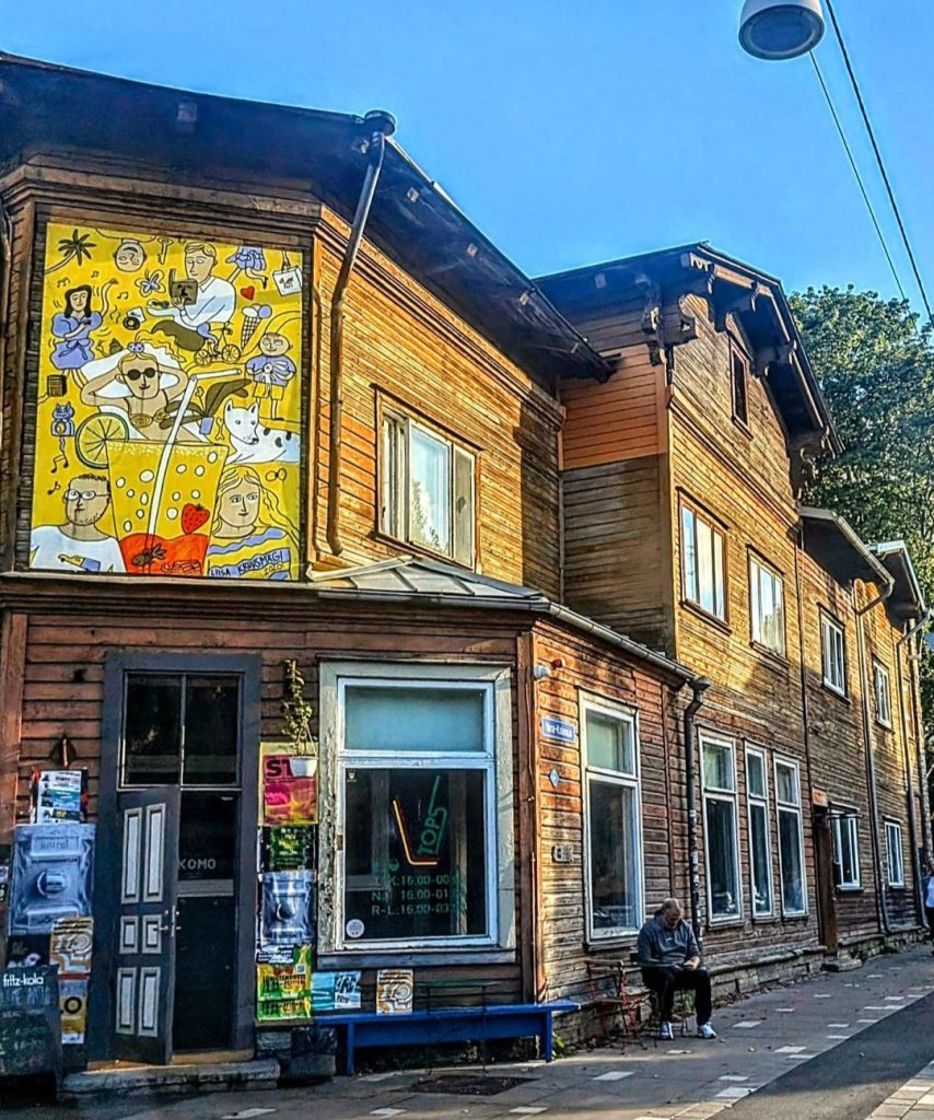 A colorful mural on a wooden building in the bohemian district of Kalamaja, Tallinn, Estonia, capturing the area's unique and artistic atmosphere.